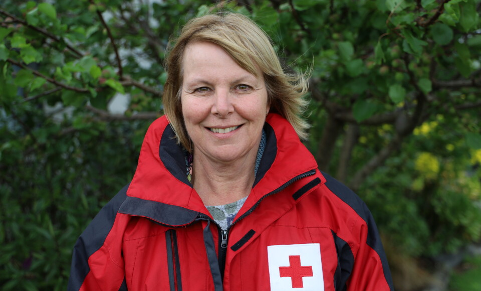 A nurse smiling at the camera.