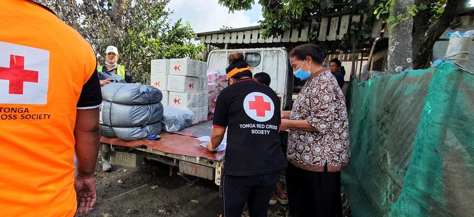 People unloading aid supplies.