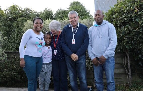 A group of adults with a child.