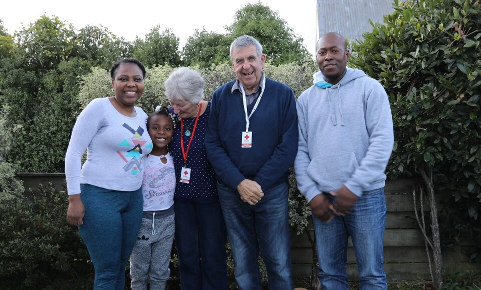 A group of adults with a child.