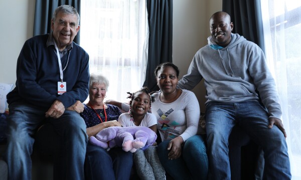 A group of people sitting on a couch.