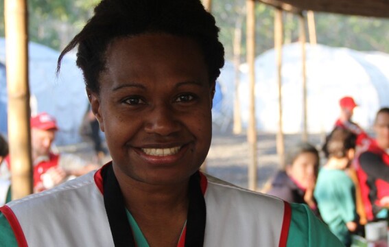 A woman smiling at the camera. 