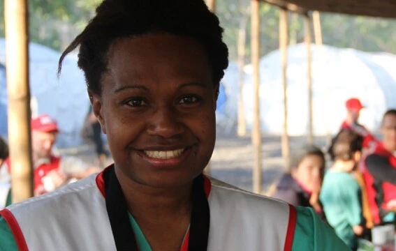 A woman smiling at the camera.