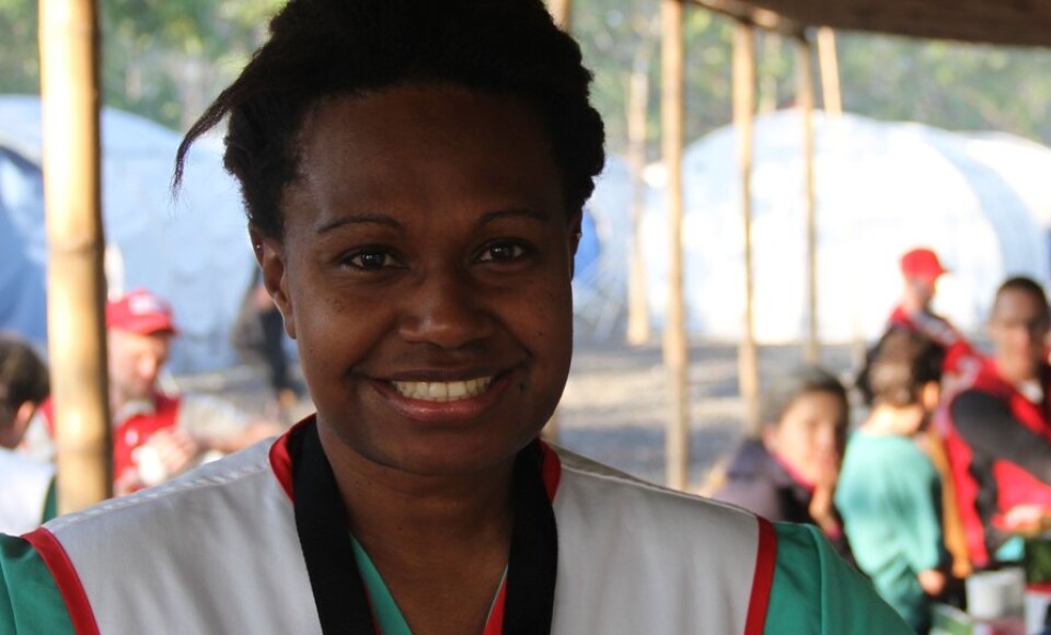 A woman smiling at the camera.
