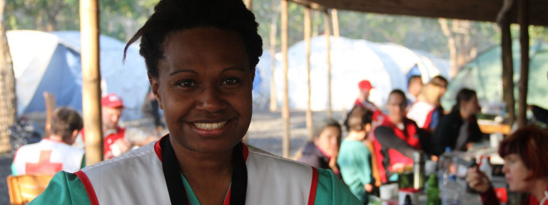 A woman smiling at the camera.