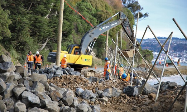 A group of men with a digger.