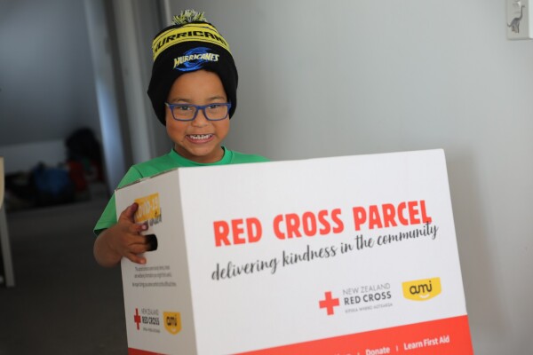 A child holding a parcel.