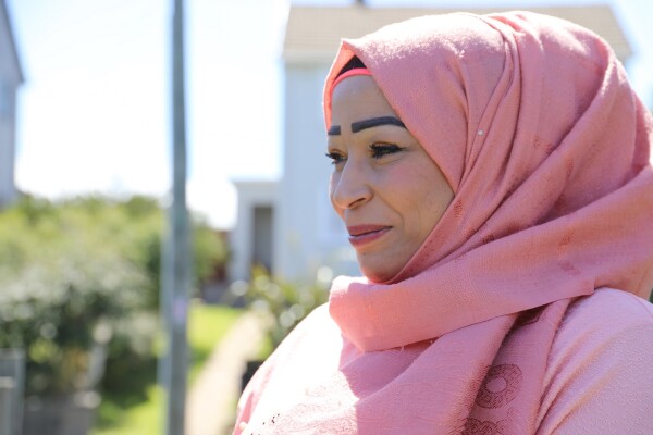 A woman in a pink hijab. 