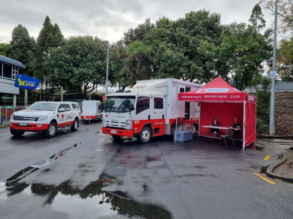 A ute, a truck, and an help station. 