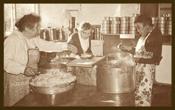 Three women cooking. 