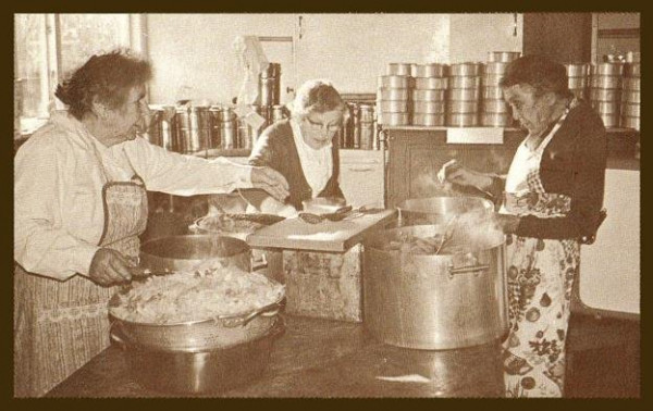 Three women cooking.