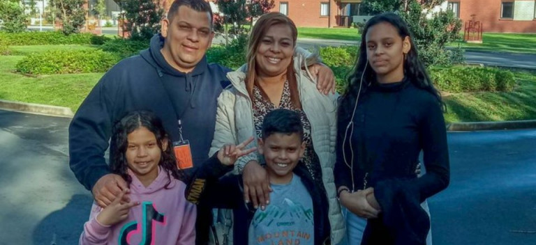Parents with three children.