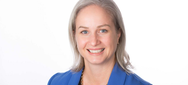 A headshot of a blonde woman.