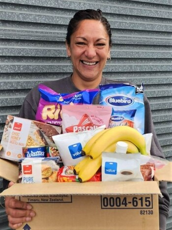 Hawke's Bay Kindness Collective coordinator Nancye with a food box delivery Hawke's Bay Kindness Collective coordinator Nancye with a food box delivery