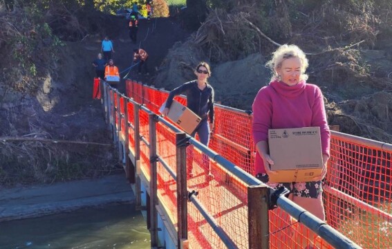 Kindness Collective volunteers carrying supplies to Cyclone Gabrielle affected