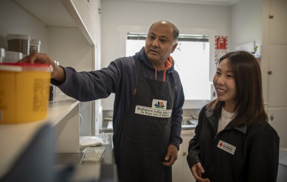 Sunil Kaushal of the Waitakere Indian Association with Red Cross co-ordinator Joan Lee