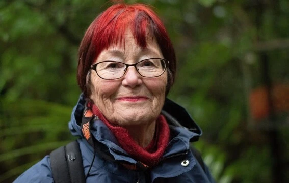 A woman with red hair smiling