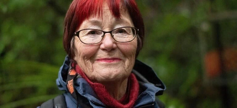 A woman with red hair smiling