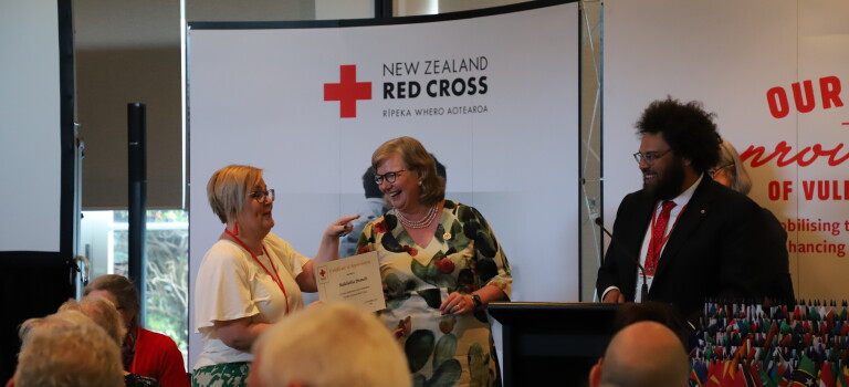 A woman receiving an award