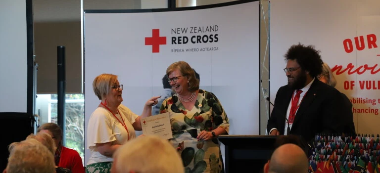 A woman receiving an award