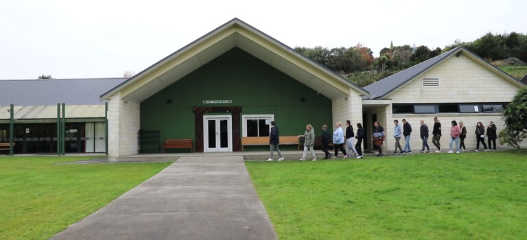 People entering Araiteuru Marae in Ōtepoti Dunedin