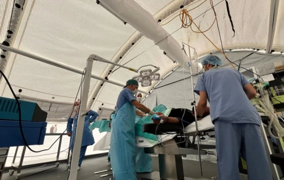 A group of doctors and nurses at the Red Cross Field Hospital in Rafah