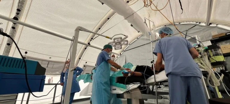 A group of doctors and nurses at the Red Cross Field Hospital in Rafah