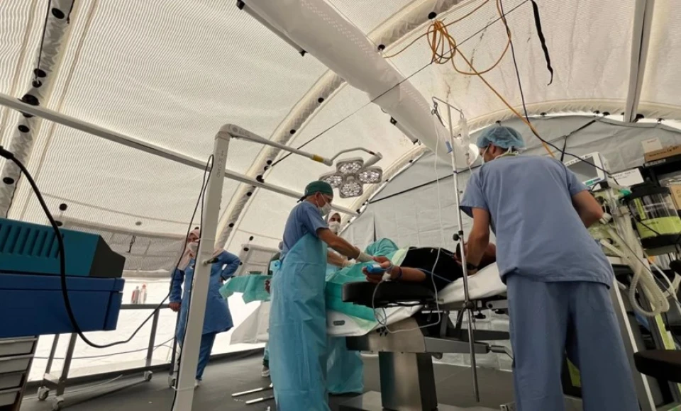 A group of doctors and nurses at the Red Cross Field Hospital in Rafah