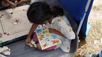 Spaces where children can still be children: 14 year old Shristi has a moment to forget the horror of seeing her home washed away.