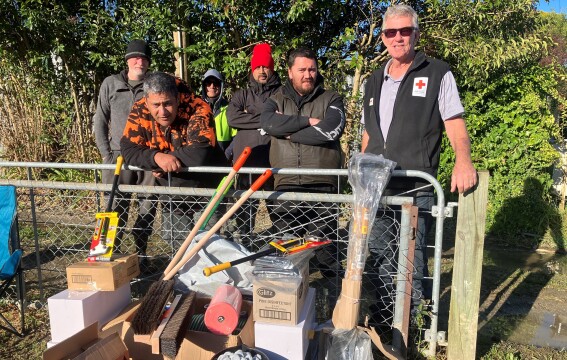 Delivering clean up kits to Te Karaka - Phil Parker on right