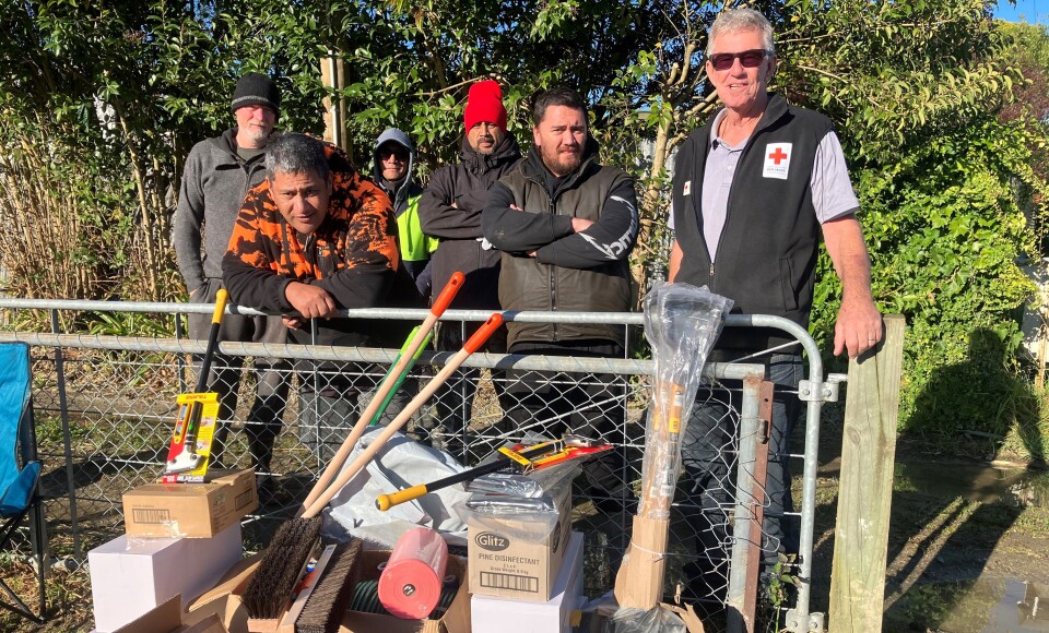 Delivering clean up kits to Te Karaka - Phil Parker on right