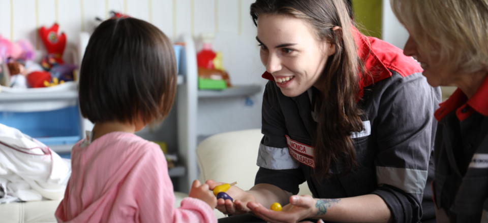 A woman talking to a child