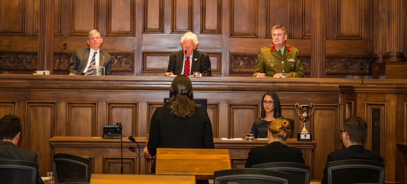 A group of people sitting in a court chamber