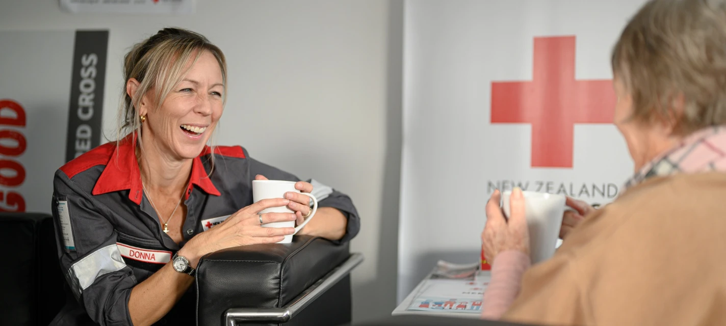 A woman laughing.
