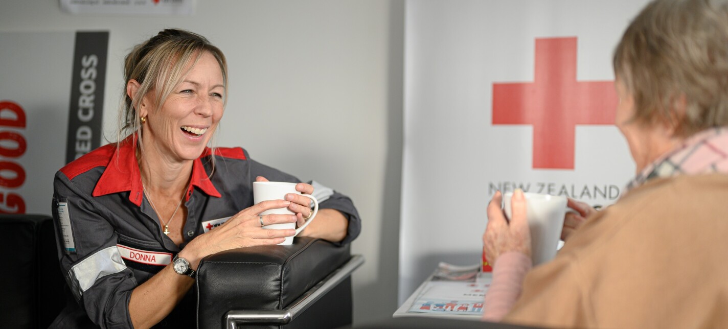 Two women chatting over a cup of coffee