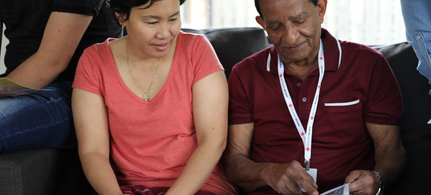 A man and woman sitting next to each other.