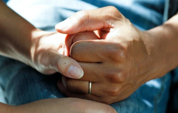 People holding hands.