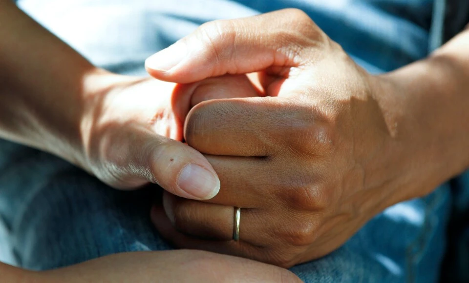 People holding hands.