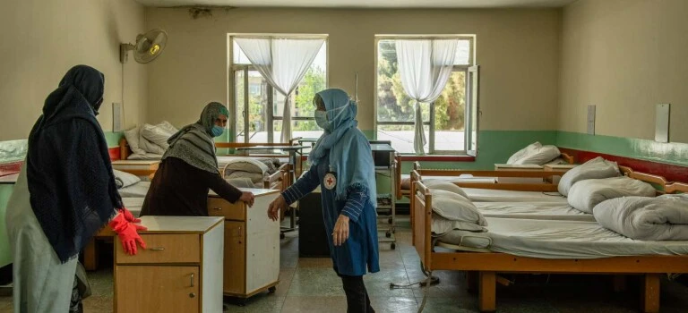 International Delegate Gail Corbett and AFRS nurses setting up a Covid-19 ward in Kabul