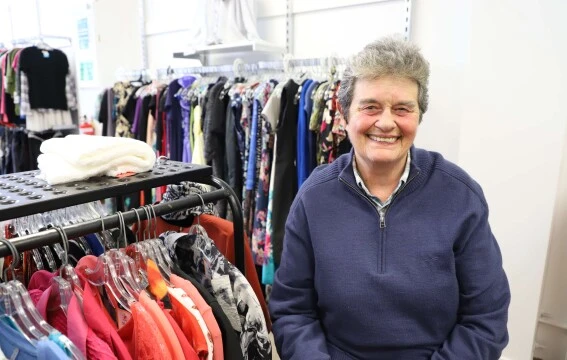 A woman smiling at the camera.