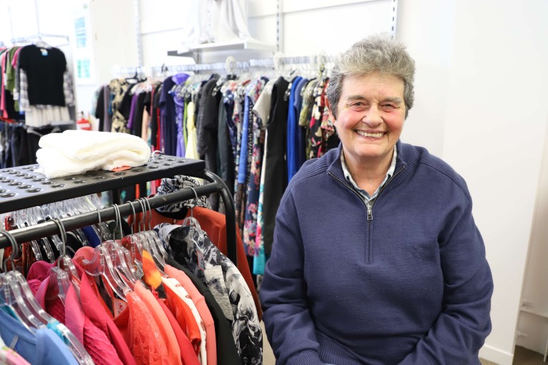 A woman smiling at the camera.
