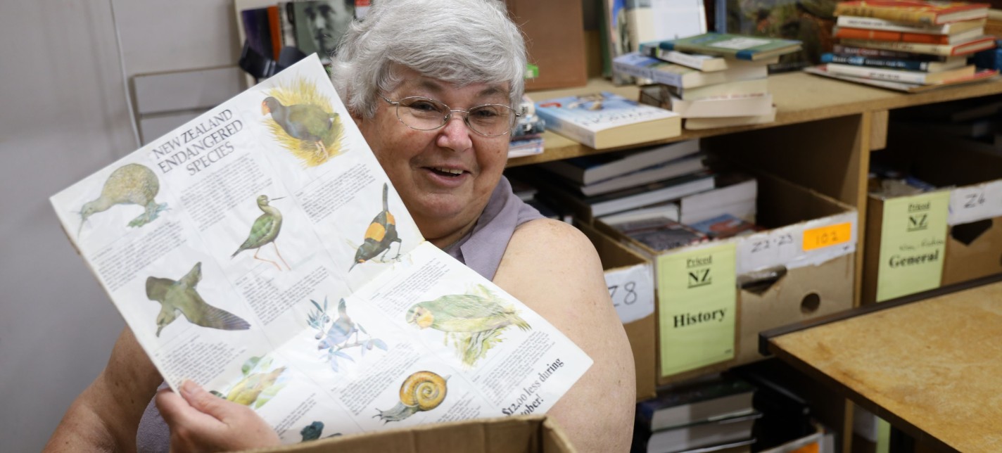 A woman showing a diagram in a book shop.