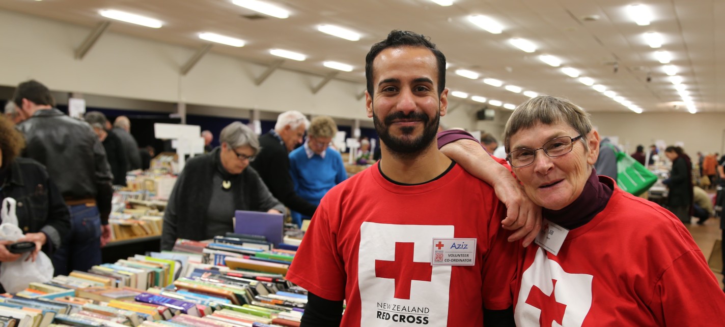 A man and woman standing together at a book fair.
