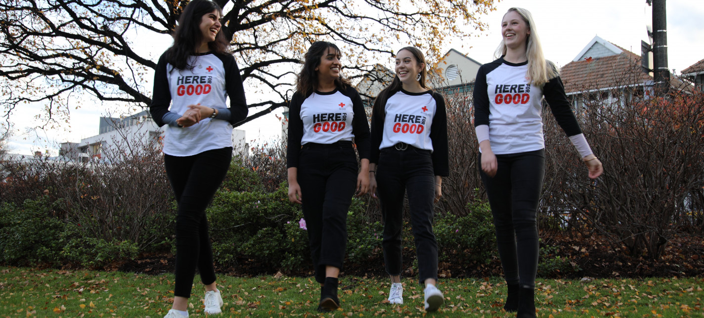 Four women standing together.