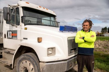 Clean-up champion Shayne Nuku with one of his trucks used to help remove debris from people’s properties